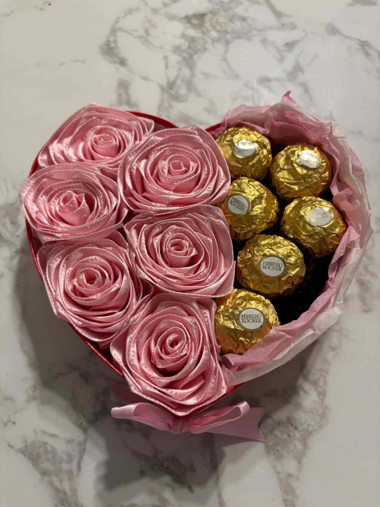 Heart-shaped box with pink ribbon roses and Ferrero Rocher chocolates